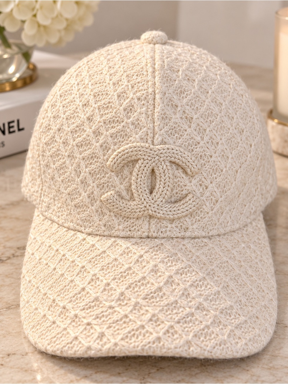 CHANEL Cream Quilted Tweed Cap with Raised CC Emblem